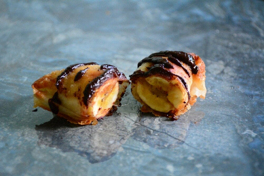 close up of turon banana lumpia with tablea sauce