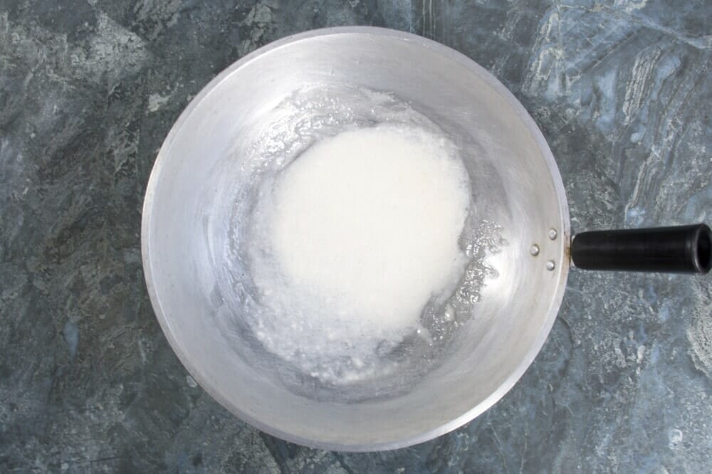 Biko with latik preparation step 5 Add Coconut Cream To Pan