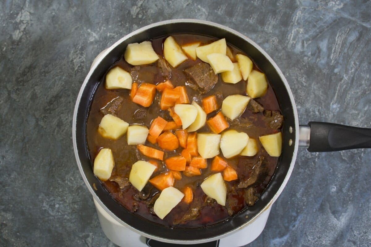 Step 5 Add Potatoes And Carrots To Stew