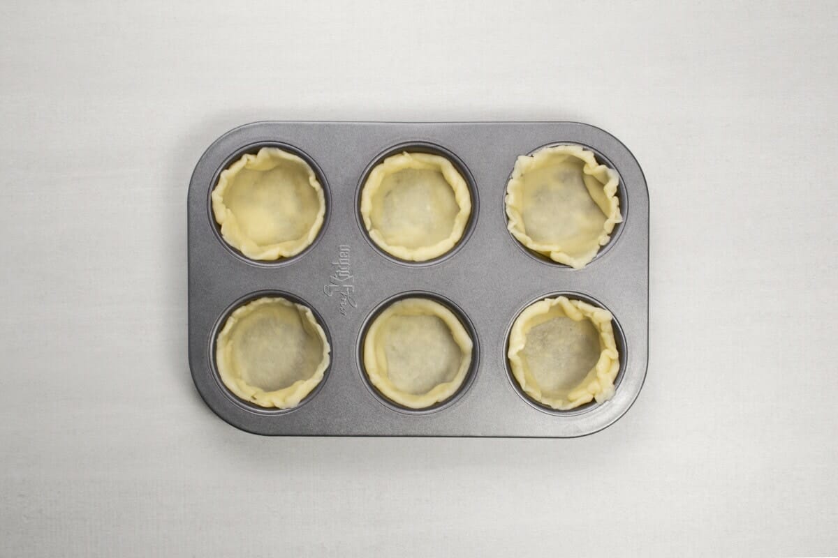 step 8 egg tart dough in muffin pan