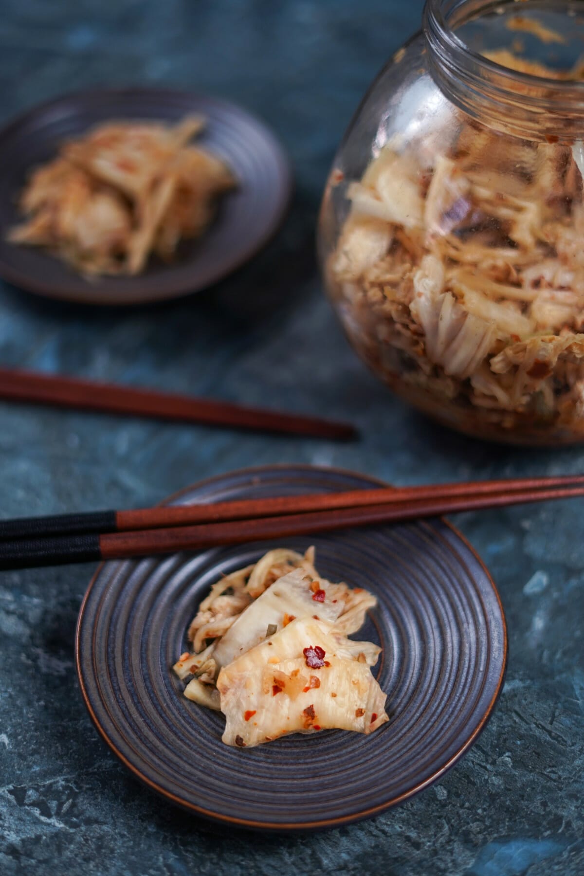 kimchi with chopsticks on plate