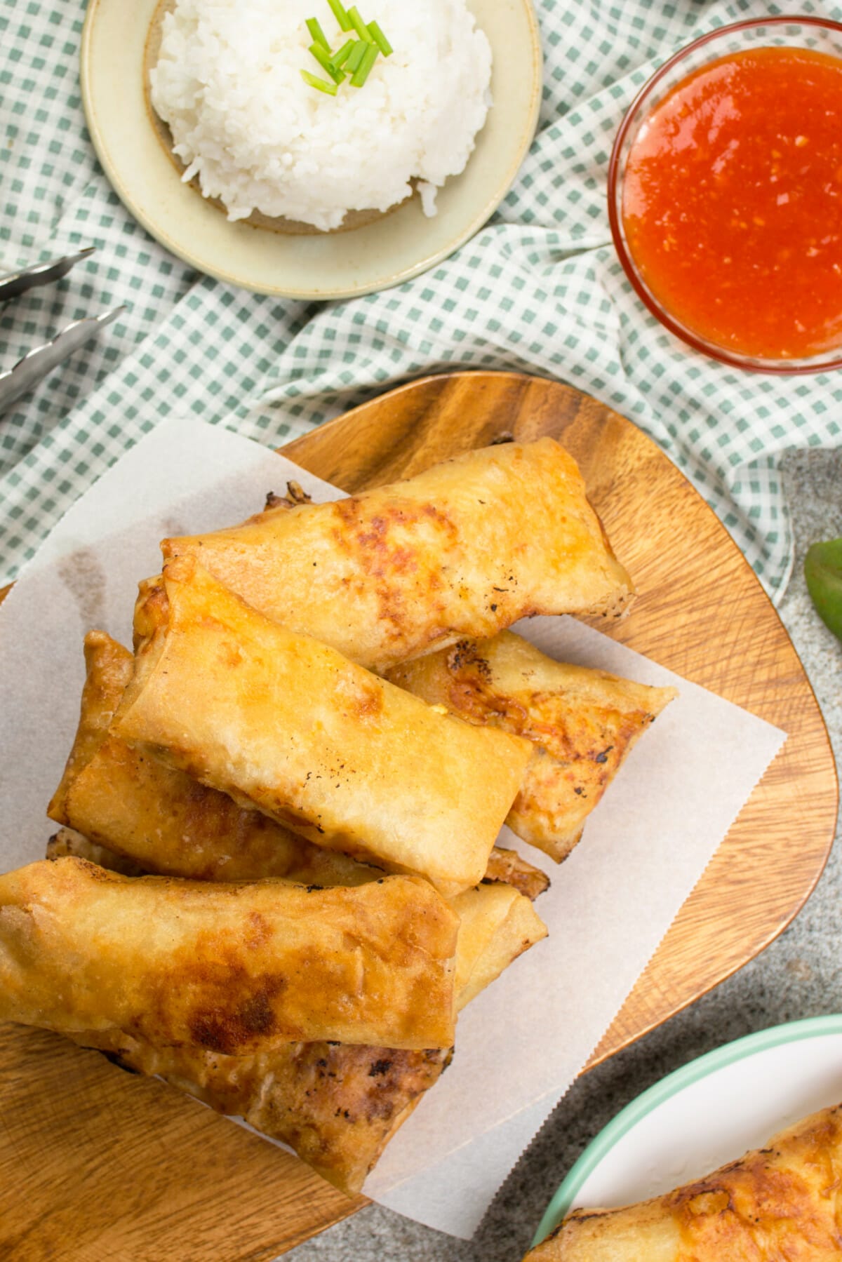golden brown chicken lumpia with rice and dipping sauce