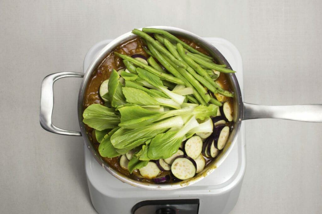 step 10 add green beans eggplant bok choy to sauce
