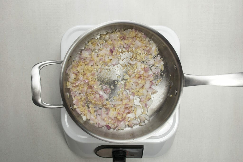 step 7 add red onions and garlic