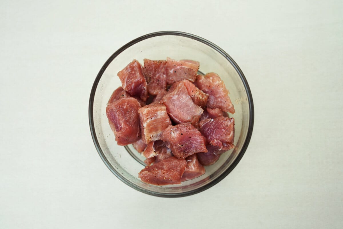 step 1 pork with salt an pepper in bowl