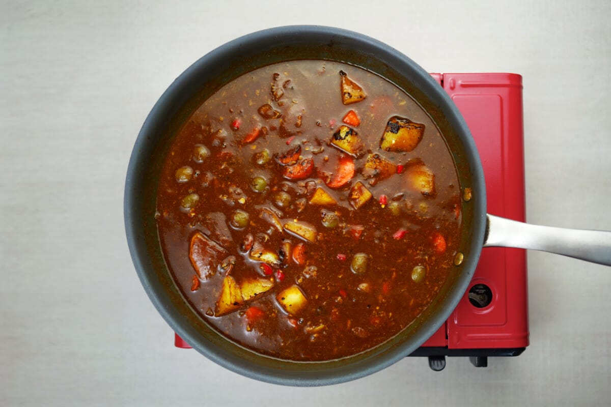 step 8 add chili peppers and olives