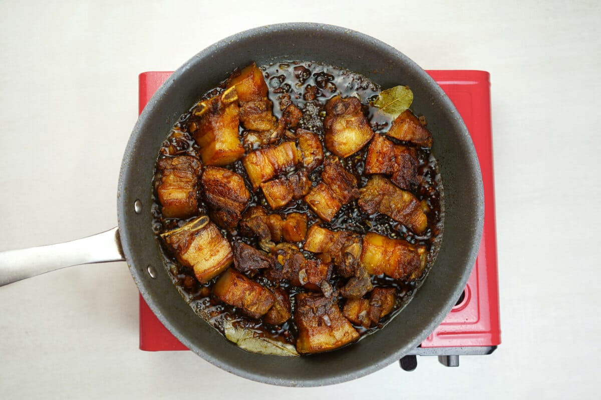 step 5 fry the slices of pork belly with soy sauce vinegar