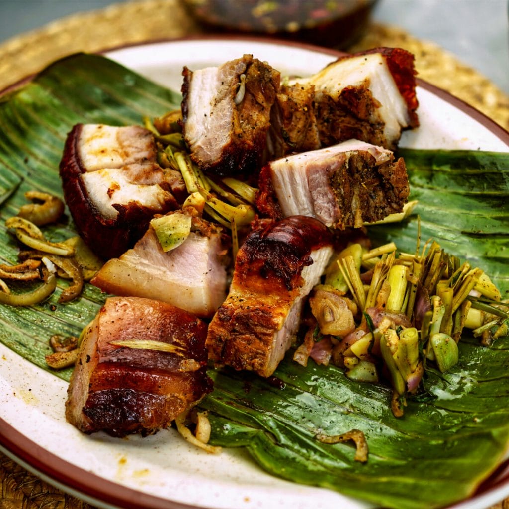 Slices of Pork Belly lechon on a plate