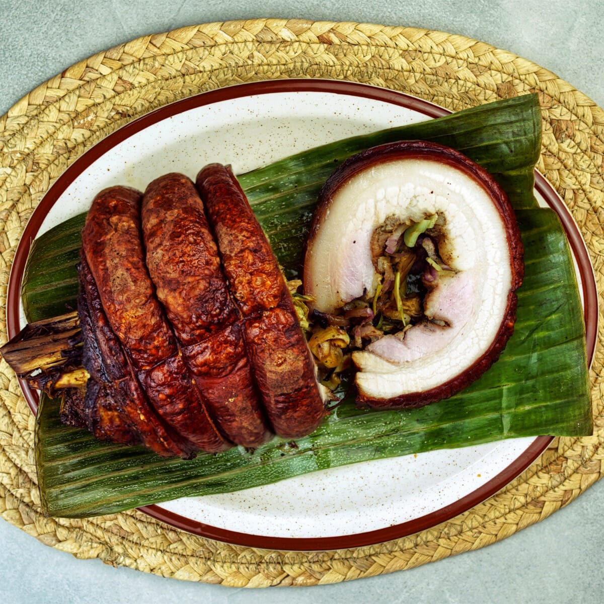 pork belly lechon with crispy skin on banana leaf
